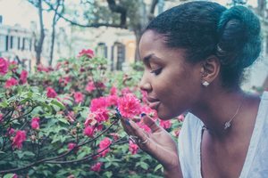 Woman Smelling the Roses - Do You Neglect Caring For Yourself?