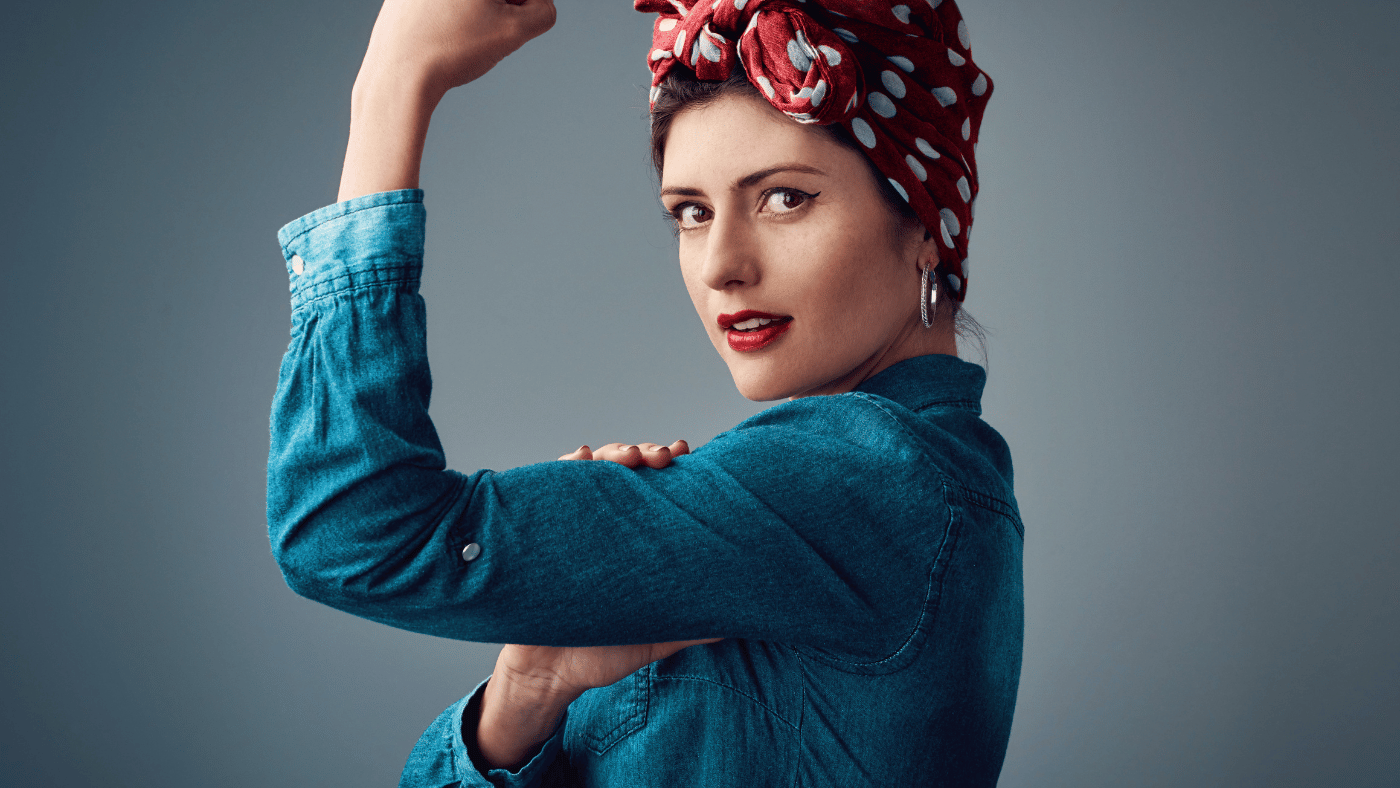 woman flexing her biceps to show her strength